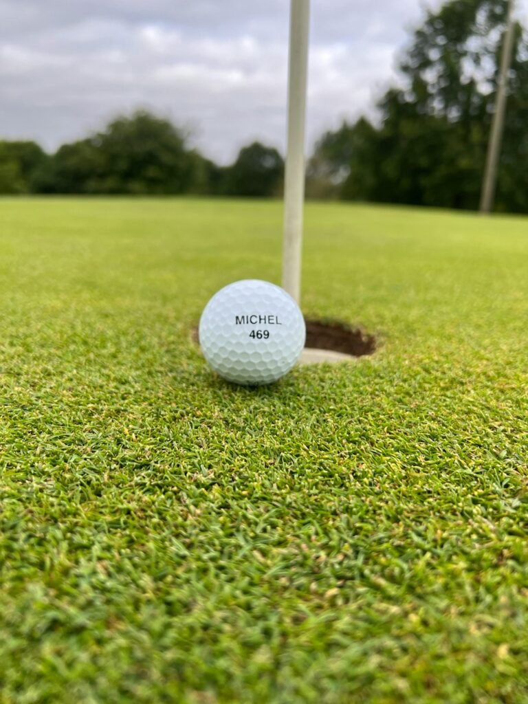 a golf ball on the grass